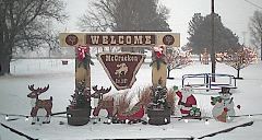 The welcome sign and the Christmas decoration at the City Park