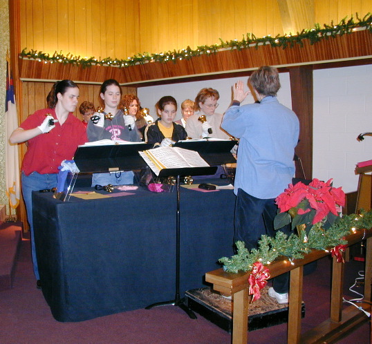 This event was a cooperative effort between St. Mary's Heritage and McCracken United Methodist Church. The Las Posadas is a re-creation of Mary and Joseph trying to find an inn for the birth of Jesus.
This picture is the McCracken United Methodist Church Bell Choir led by Arlene Gilbert