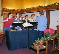This event was a cooperative effort between St. Mary's Heritage and McCracken United Methodist Church.  The Las Posadas is a re-creation of Mary and Joseph trying to find an inn for the birth of Jesus.   This picture is the McCracken United Methodist Church Bell Choir led by Arlene Gilbert