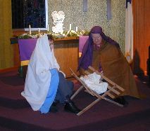 In the sanctuary of McCracken United Methodist Church are Mary, Joseph and the baby Jesus protrayed by Rev. Marilyn and Lloyd Crissmore