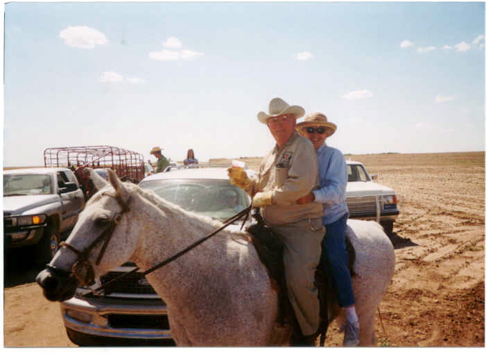 Jack Wilson - Shirley Higgins. This is on the trail ride on July 10 -- 100 degrees plus.  The beer was for "my horses".