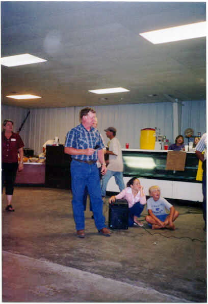 Also pictured are Angela Morgan and Carly Derr.  Roger is a worker at the rodeo grounds along with hundreds of others.  He is an auctioneer.