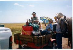 Carolyn Thompson and Shirley Higgins ride the beer wagon.  Tracy Wagner, Rush Center, enjoys a cold brew on a hot day.