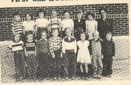 Grade School 1951-1952 1st & 2nd Grades 2nd row:  Gary Turner, Betty Jane Pfaff, Mary Ann Zeller, Johnny Spomer, Kenny McCormick, Sharon McCaskey, Romelda Pfannenstiel, Mrs. Edith Pearson, teacher.

 

1st row:  Jane Graf, Bobby Muller, Sheila Wierman, Reggie Irvin, Terry Herdman, Wanda Faye Harp, Danny Rein, Marilyn Conrad.