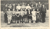 Grade School 1951-1952 Grades 6th, 7th, & 8th 2nd row: Bill Wierman, Walter Pfaff, Perry J. Irvin, Gary Walker, James Hanson, Geraldine McCaskey, Furlen Irvin, Carla Rodeman, Miss Lorraine Lacey, teacher, Norman Pfannenstiel. 1st row: Alberta Anderson, Marlene Wilson, Louise Gerritzen, Joyce Showalter, Arlene Wilson, Karen Walker, Peggy Harper, Patty Graf.