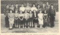 Grade School 1951-1952 Grades 6th, 7th, & 8th 2nd row:  Bill Wierman, Walter Pfaff, Perry J. Irvin, Gary Walker, James Hanson, Geraldine McCaskey, Furlen Irvin, Carla Rodeman, Miss Lorraine Lacey, teacher, Norman Pfannenstiel.   1st row:  Alberta Anderson, Marlene Wilson, Louise Gerritzen, Joyce Showalter, Arlene Wilson, Karen Walker, Peggy Harper, Patty Graf.