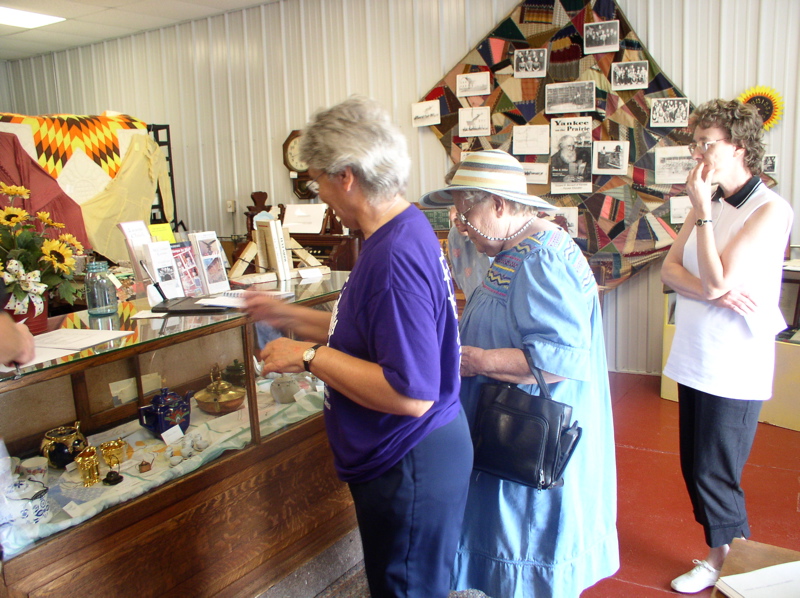 Carolyn Thompson, Arlene Ingraham Rues, Marilyn Wierman Sommers at Museum enjoying the teapot display