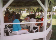 Arlene Gilbert prepares the alumni band at the gazebo at City Park   Art work done by Bob Foster and Paulette Harp used in skit at the alumni meeting.