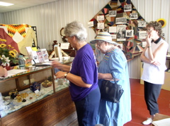 Carolyn Thompson, Arlene Ingraham Rues, Marilyn Wierman Sommers at Museum enjoying the teapot display