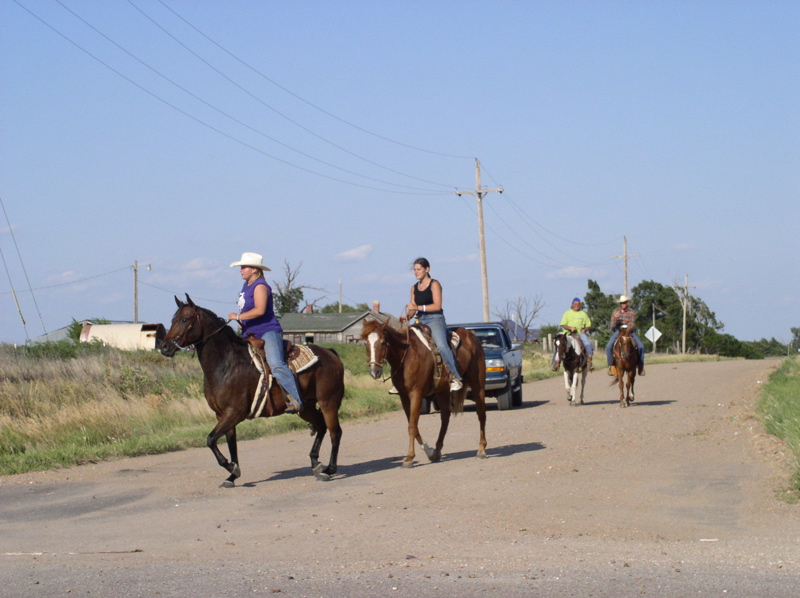 Nicole Ryan, Lisa Legleiter on trail ride coming into McCracken