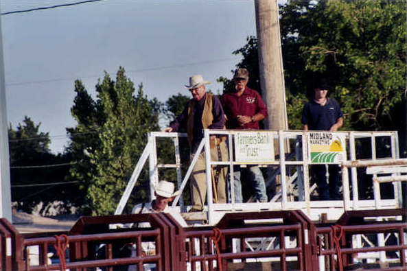 Rodeo catwalk, Jack Wilson and Bill Greenway with rodeo cowboys