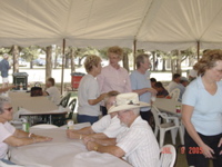 Curly Juvenal, Pat Derr sitting at table, Priscella Jacobs, Gail Keady and Mary McCormick