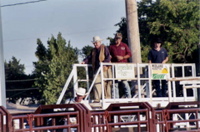 Rodeo catwalk, Jack Wilson and Bill Greenway with rodeo cowboys